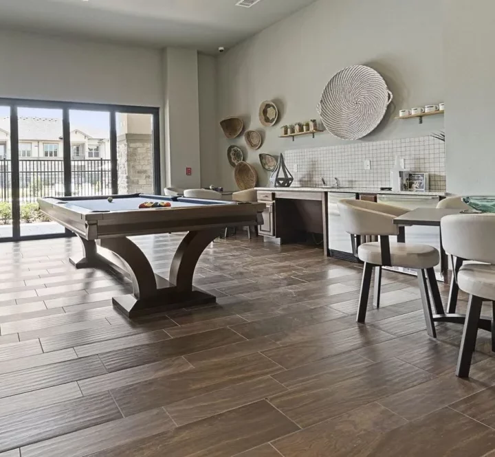 pool table in a living room with a dining table at The Auberge of Tyler