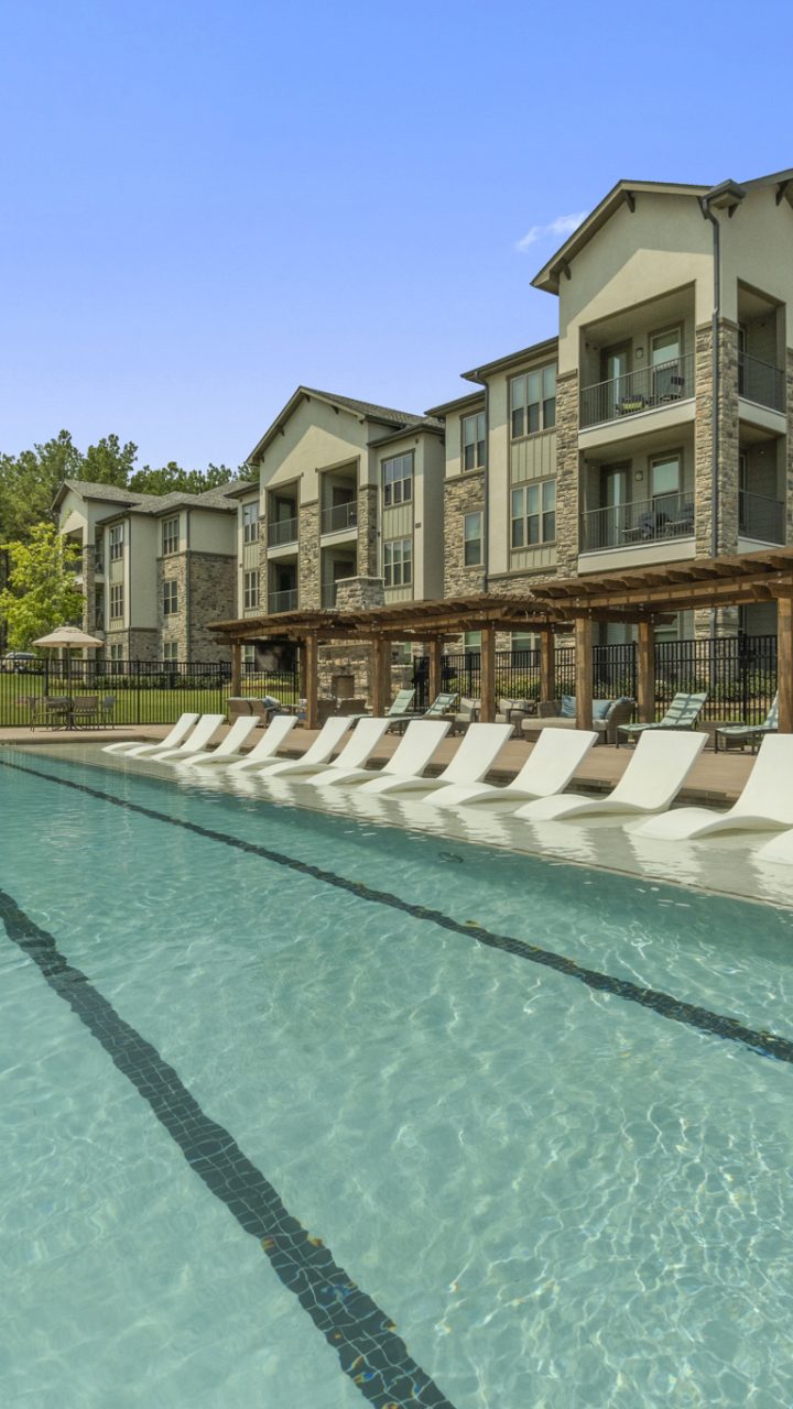 Apartments for rent in Tyler, TX. Resort Style Swimming pool with lounge area and cabanas.